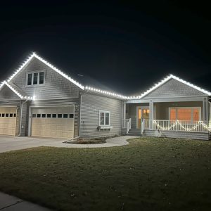 Home Revival Holiday Lighting: Custom Christmas light design on a Fargo, ND home.
