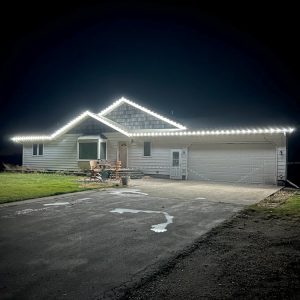 Home Revival Holiday Lighting installation: beautifully illuminated house with permanent Minleon lights.