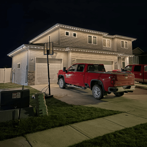Home exterior illuminated with Minleon permanent LED lighting, showcasing customizable curb appeal in Fargo, ND/Moorhead,